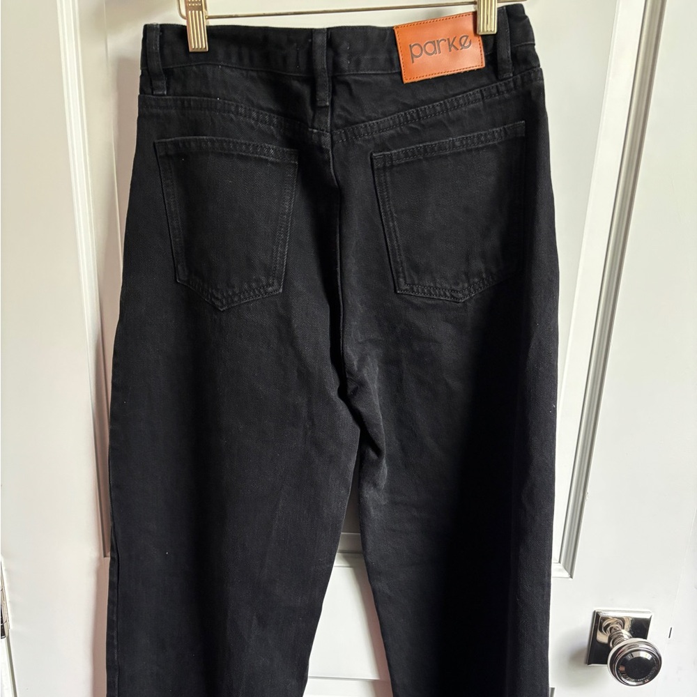 Parke woman’s Black Medium Wash Mid Rise Jeans Sz 25 wide legged frayed